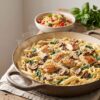 Creamy one-pot pasta with chicken, mushrooms, spinach and Parmesan served in a Dutch oven